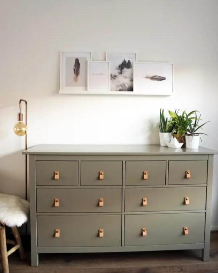 Muted olive painted Ikea Hemnes dresser with leather drawer pulls from BeautyIll Cozy, natural material contrast with soft lighting and simple decor.