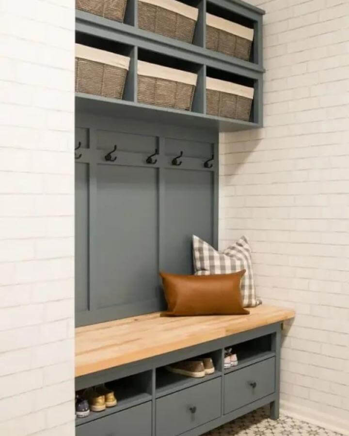 Muted blue-gray painted Hemnes bench mudroom with natural wood seat and wicker baskets from House by Hoff practical and stylish storage solution.
