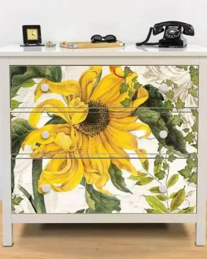Yellow sunflower design on white Ikea Hemnes dresser from Retro Planet with nature-inspired vibrant floral drawer art.
