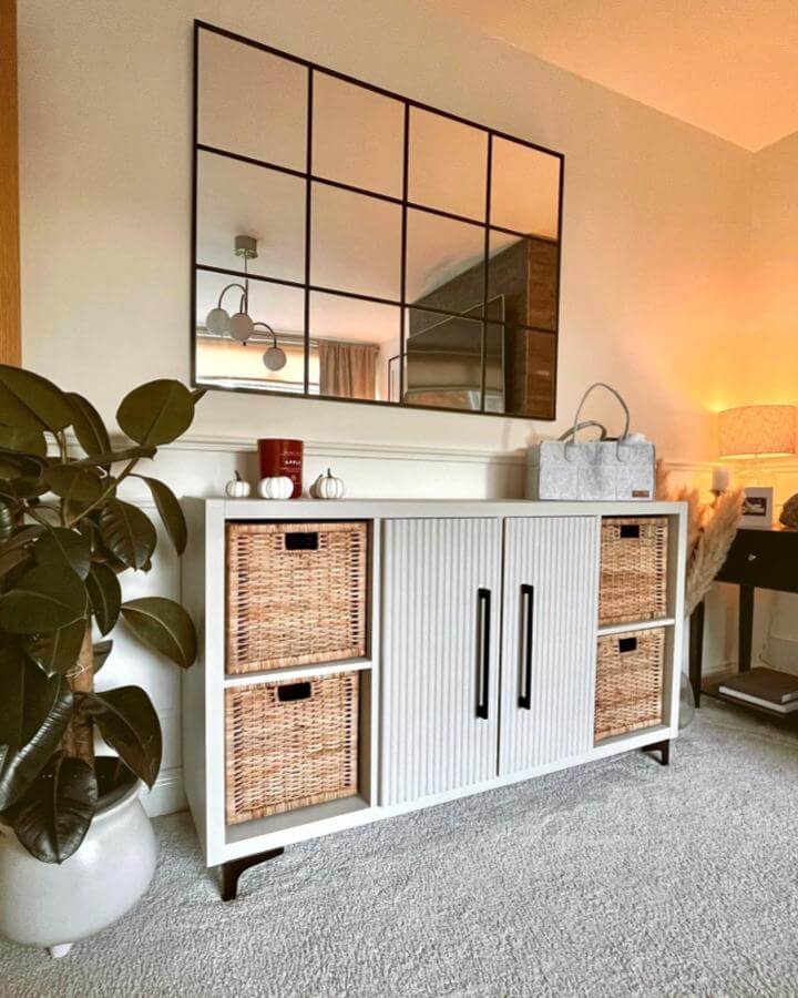 white Kallax sideboard with wicker baskets and black handles from @lifeatlangdale. Retro ribbed doors upgrade ikea kallax hacks & ideas storage with style