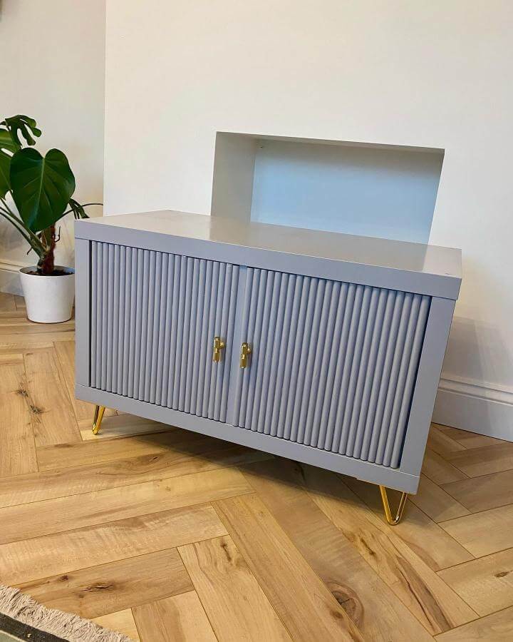 grey sculptural textured Ikea Kallax storage unit with gold legs and handles from @reno_at_223 showcasing chic ikea kallax hacks & ideas