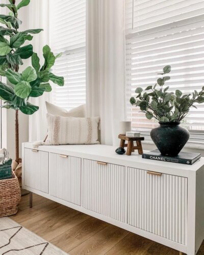 white vertical slat front ikea kallax hack bench storage with gold handles from @xomyhome modern stylish room seating and decor