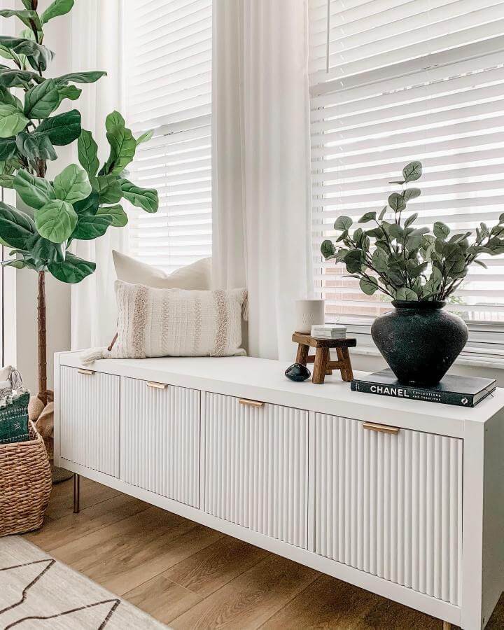 white vertical slat front ikea kallax hack bench storage with gold handles from @xomyhome modern stylish room seating and decor