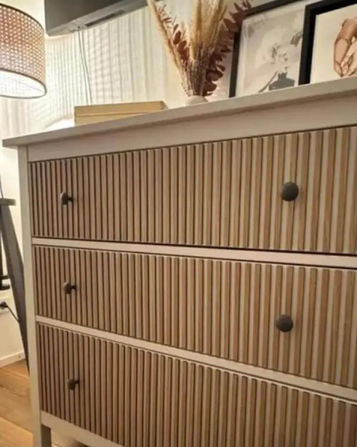 Beige and light wood textured drawer fronts on Ikea Koppang hacks from Artvoom with black knobs and warm cozy room details.