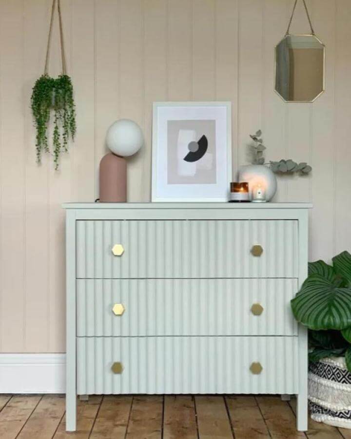 Light mint green textured Ikea Koppang dresser with gold hexagonal knobs styled with modern minimal decor by @crack_the_shutters