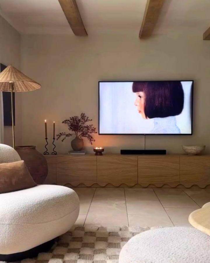 light wood media center with wavy fronts from @mishkashoe showing ikea media center hacks & ideas in warm living room setting