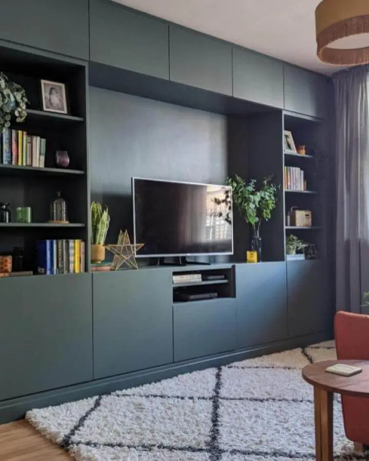 Dark matte green built-in media center with open shelves and cabinets in living room from @nospacelikehome.uk. Neat and modern ikea media center hacks & ideas.