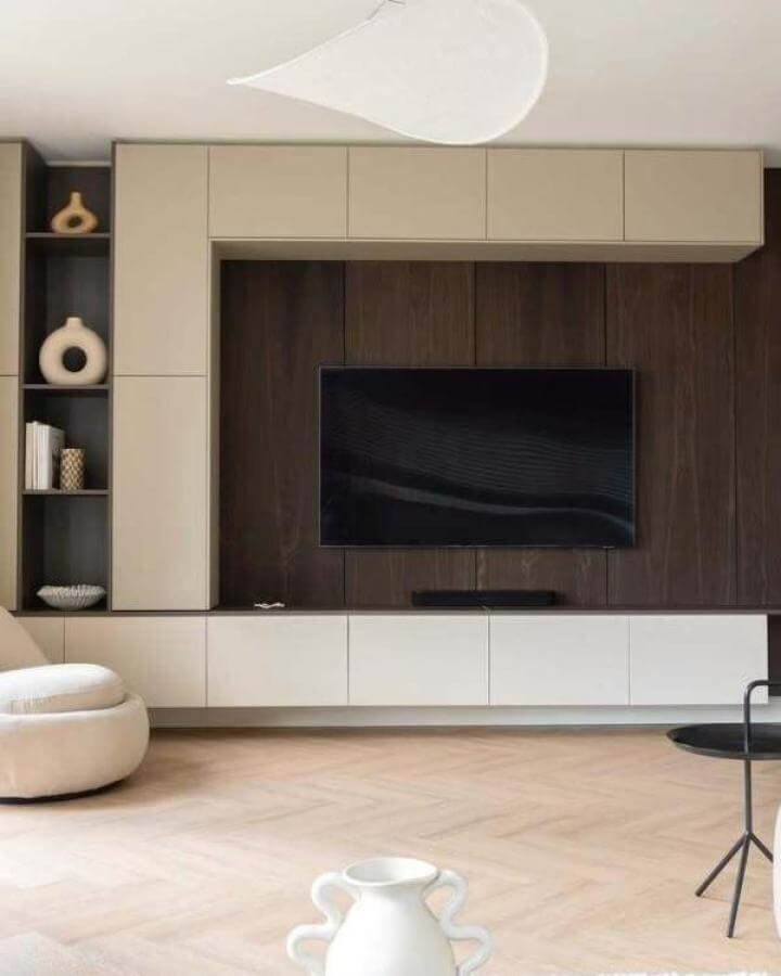 Light beige and dark wood floating media center from @styleandsugar with minimalist storage and open shelving ikea media center hacks & ideas.