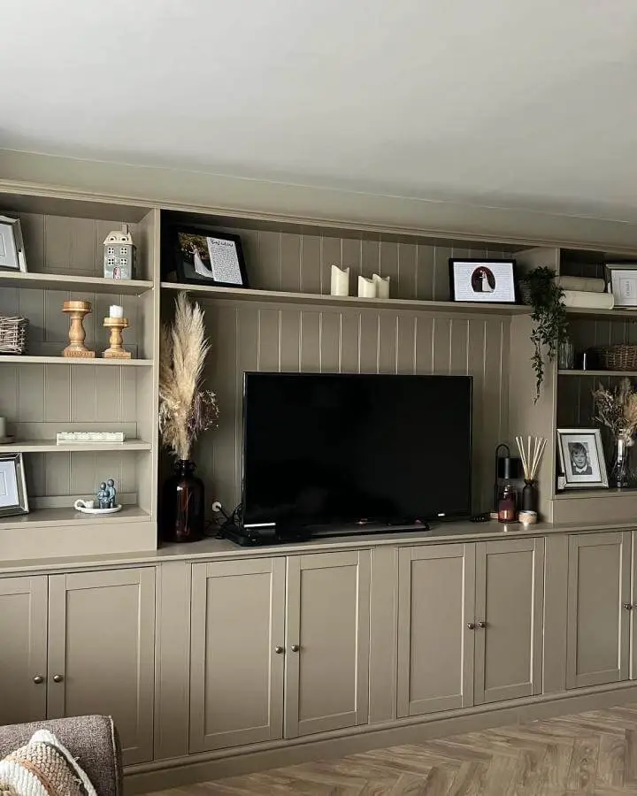 taupe built-in media center from @turner_no13_home with natural decor and elegant closed cabinets ikea media center hacks & ideas