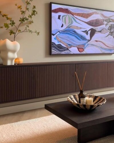 Dark slatted wood media center with decor from @huisjeinhetpark showcasing ikea media center hacks & ideas.