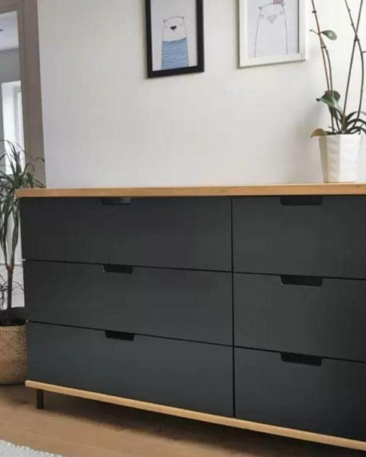 matte black Ikea Nordli dresser with natural wood top and base trim in modern living space ikea nordli hacks