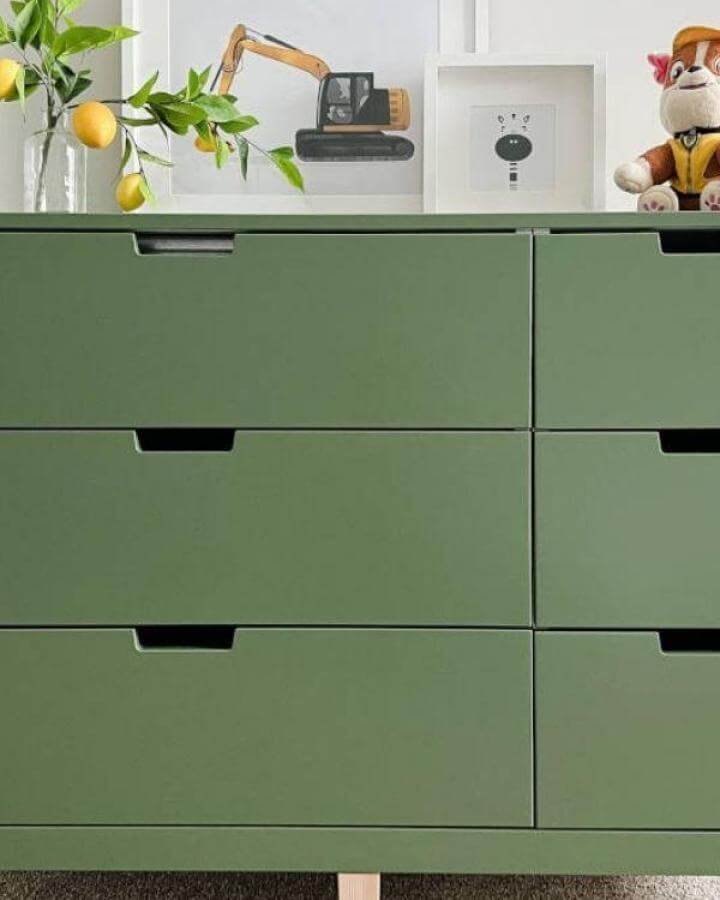 Green matte Ikea Nordli hacks dresser with wood legs in a stylish modern room from Fun Home Building.