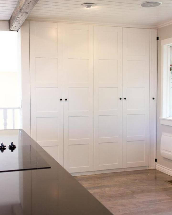 White shaker style door Ikea Pax storage inspired by Jenna Sue Design with black knobs and clean farmhouse vibes.