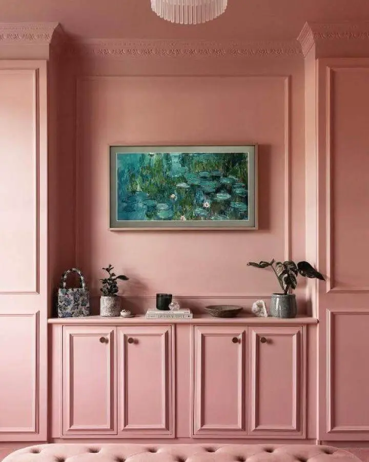 Pink painted Pax wardrobe with classic moulding and small decorative objects from @itsnotsogrimupnorth showing elegant ikea pax hacks.