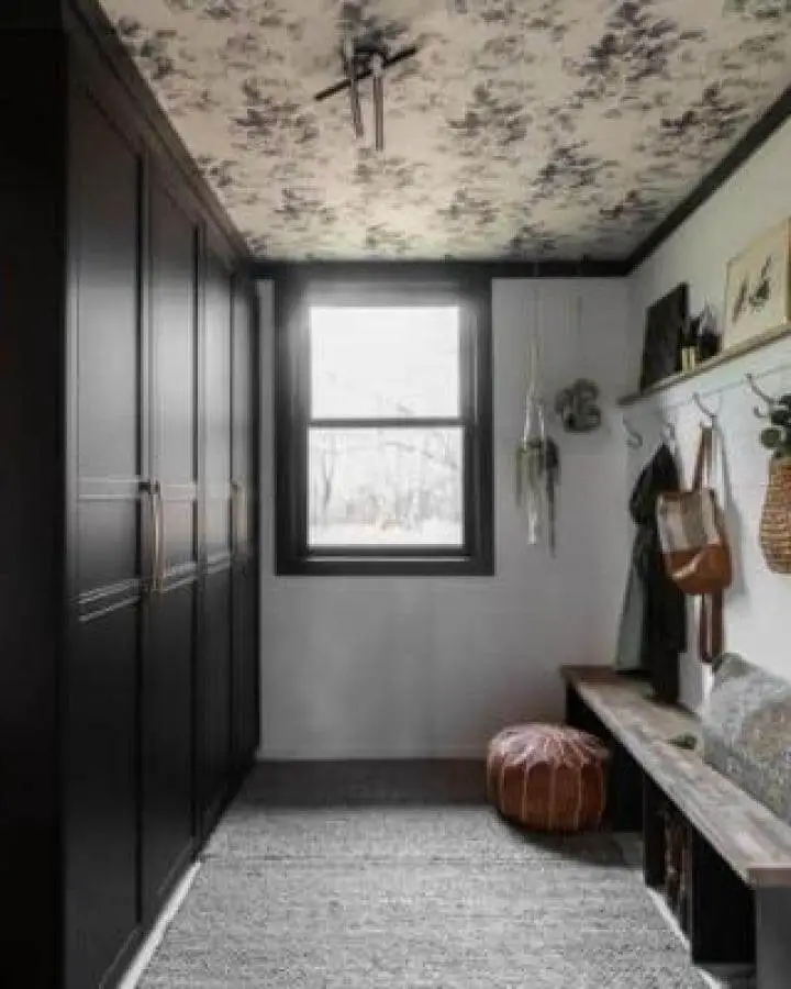 Dark matte black Pax wardrobes with floral ceiling in cozy organized room from Bright Green Door Ikea pax hacks inspiration.