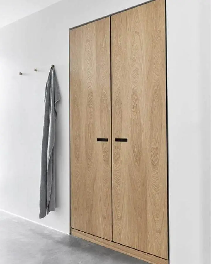 Light oak wood finish closet doors with recessed black handles from &SHUFL. Minimalist modern ikea pax hacks design.