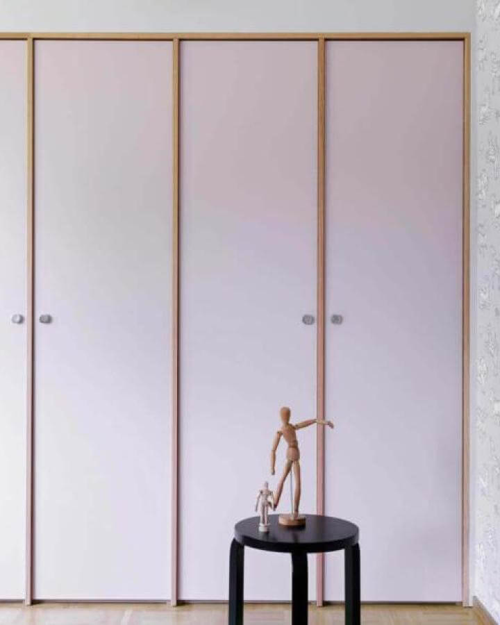 Light pink doors with natural wood trim on closet from Helsingo ikea pax hacks simple elegant design.