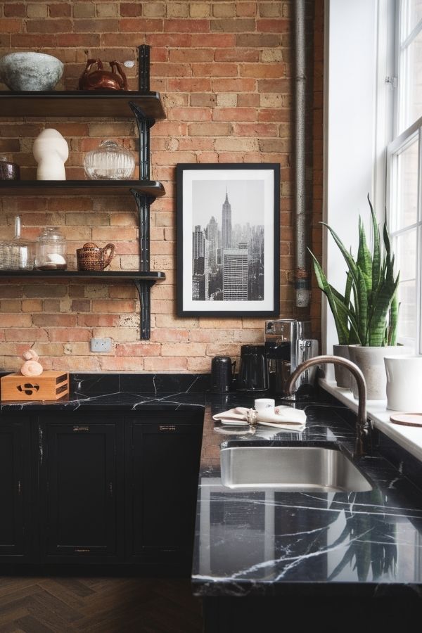 Modern kitchen featuring sleek black countertops and stainless steel appliances.