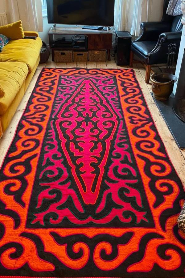 Fiery patterns ignite vibrant atmosphere, enhancing living room rug ideas.