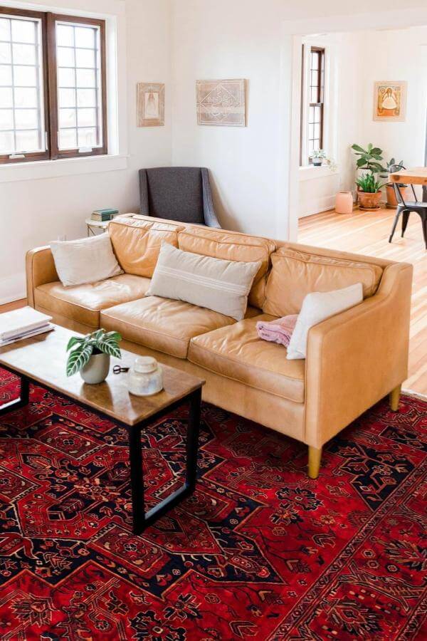 Colorful tapestry enhances cozy space, inspiring living room rug ideas.