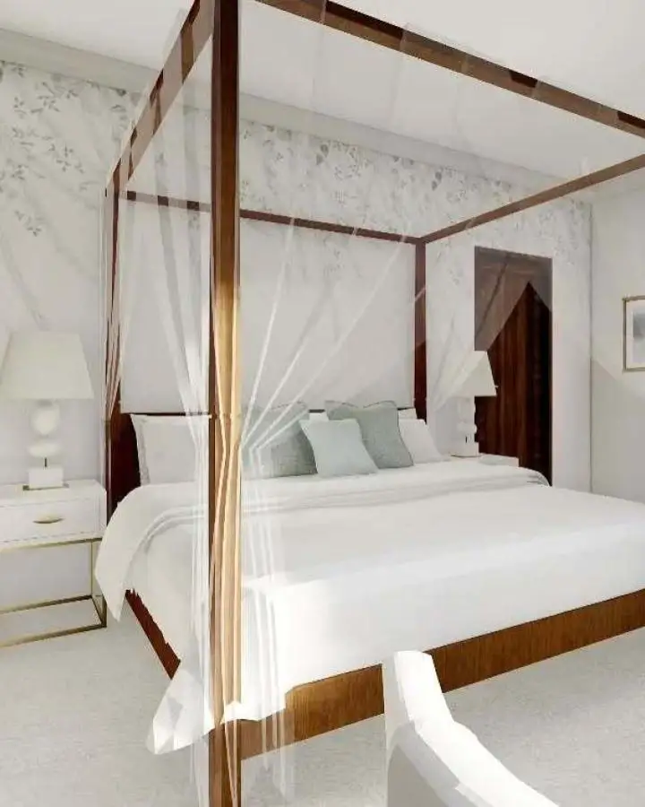 Walnut four-poster bed from @lydia.amanda.interiors showcasing luxurious master bedroom ideas with white curtains and linens.