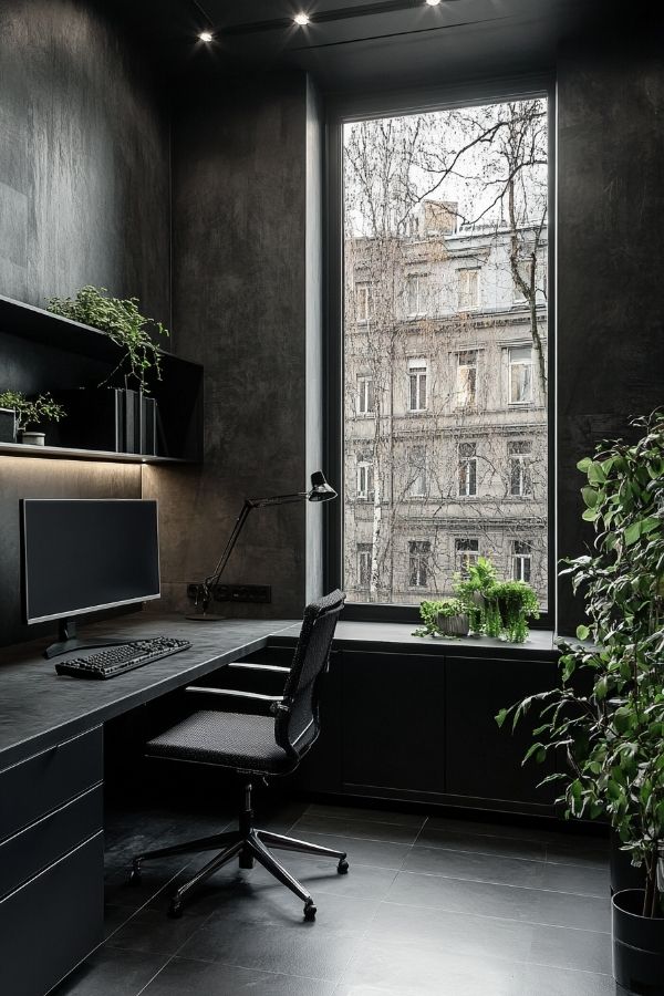 masculine home office with dark wood desk and black leather chair