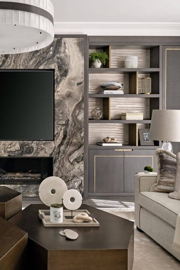 Striking marble enhances media wall ideas, bringing natural elegance indoors.