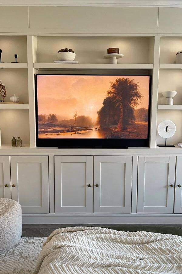 Tranquil beige enhances cozy comfort in innovative media wall ideas.