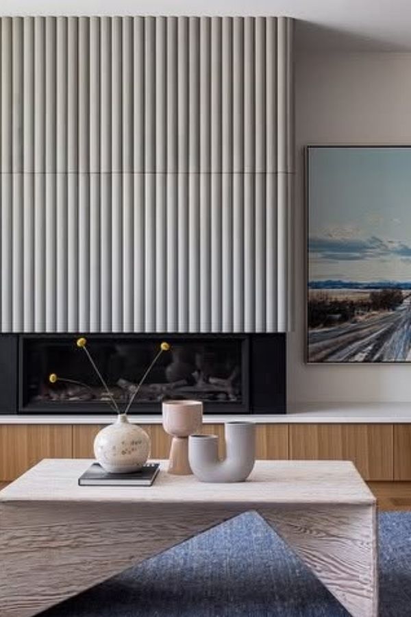 A contemporary fireplace with stylish, angular geometric textures and designs.