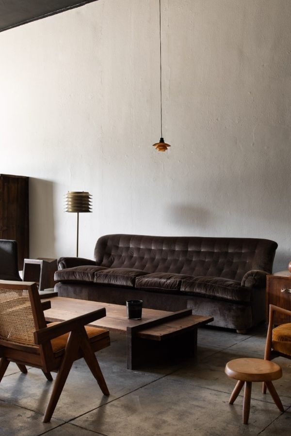 Industrial chic space featuring dark wood tones and metallic accents.