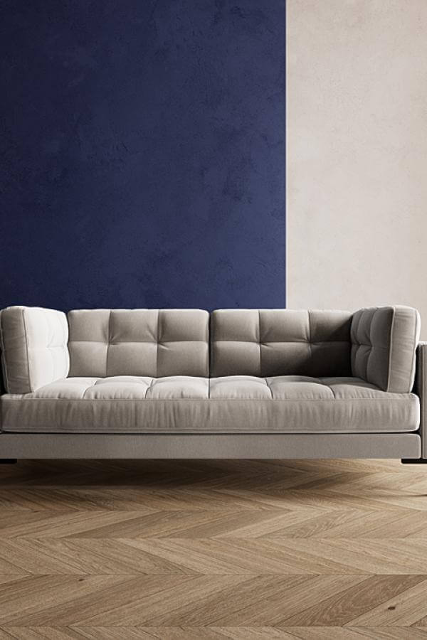 Cream leather sofa from Sofology. Two-tone walls enhance its timeless mid-century appeal.