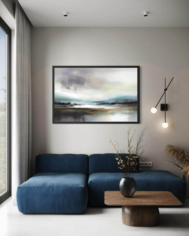 Navy blue sofa and abstract coastal painting in modern living room with natural wood coffee table from @aquarius_age_art. Serene and simple coastal chic design.