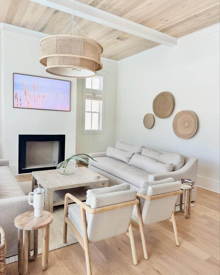 Light wood and woven rattan living room decor from @pinterestingplans featuring airy neutral tones and natural texture accents for coastal style.