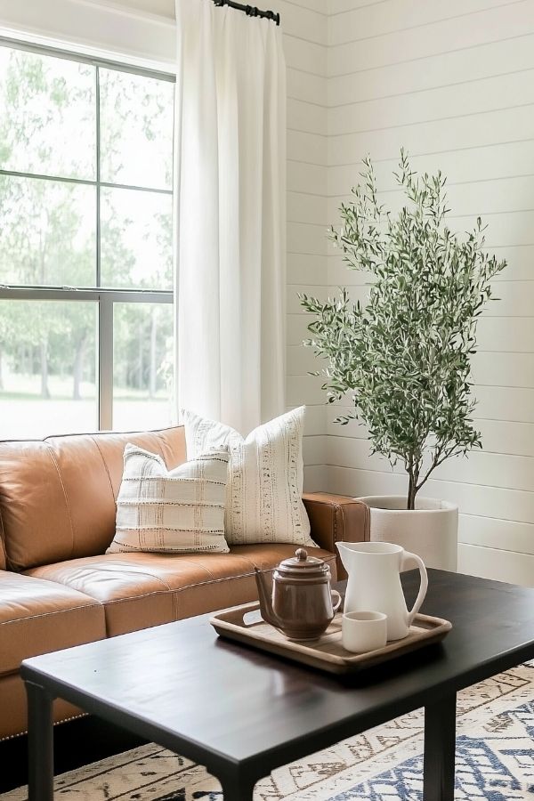 Modern cottage living room featuring rustic wooden beams and cozy decor.