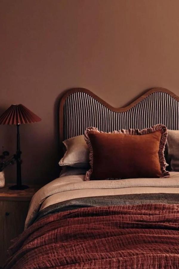 Warm, inviting bedroom with earthy tones; perfect for moody bedroom ideas.