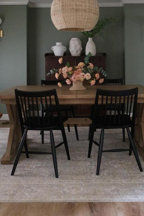 Moody dining room with woven pendant light; moody dining room ideas.