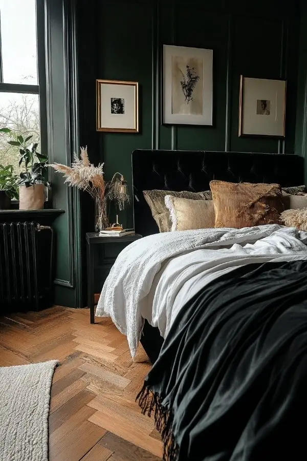 Moody romantic bedroom with dim lighting, velvet drapes, and candles.