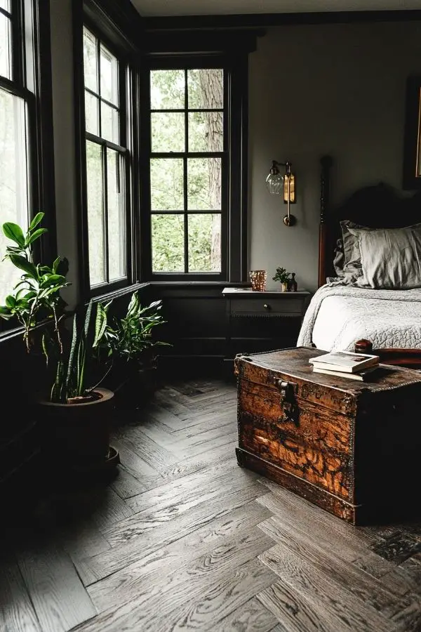 Dimly lit bedroom with soft, flowing curtains and plush bedding.