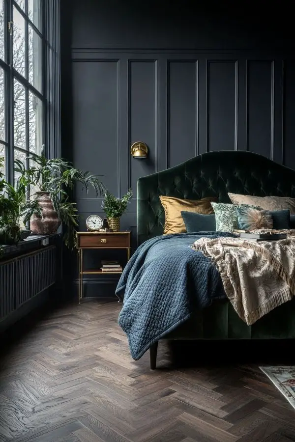 Moody romantic bedroom with soft lighting, velvet drapes, and candles.