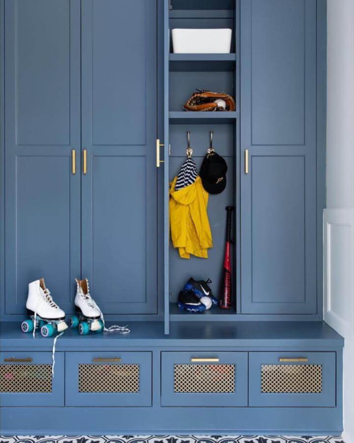 Bold Blue Mudroom Built Ins Ideas With Brass Hardware And Mesh Drawer Fronts From @williamshousellc Featuring Sports Gear Storage