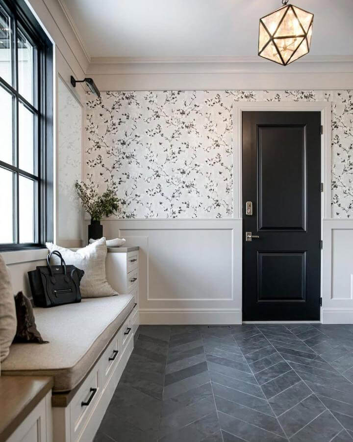 Charcoal chevron slate flooring in mudroom space from @verandaestatehomes. Bold pattern with natural stone texture and durable finish.