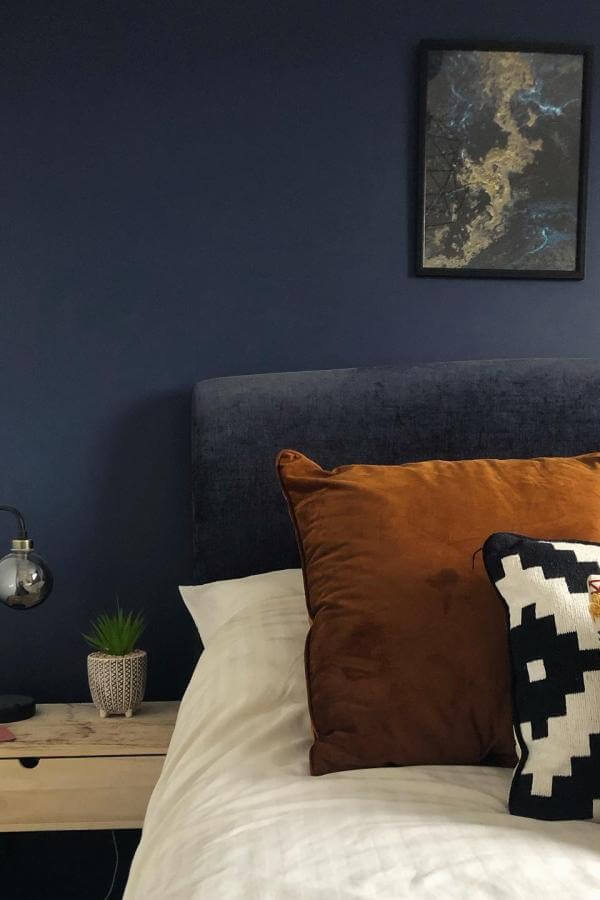 Rust-toned velvet pillow from @housefifty5. Adds warmth and complements navy bedroom ideas beautifully.