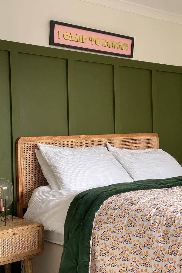 Playful colorful wall art from @rmmountskip adds a funky twist to an elegant olive green bedroom.