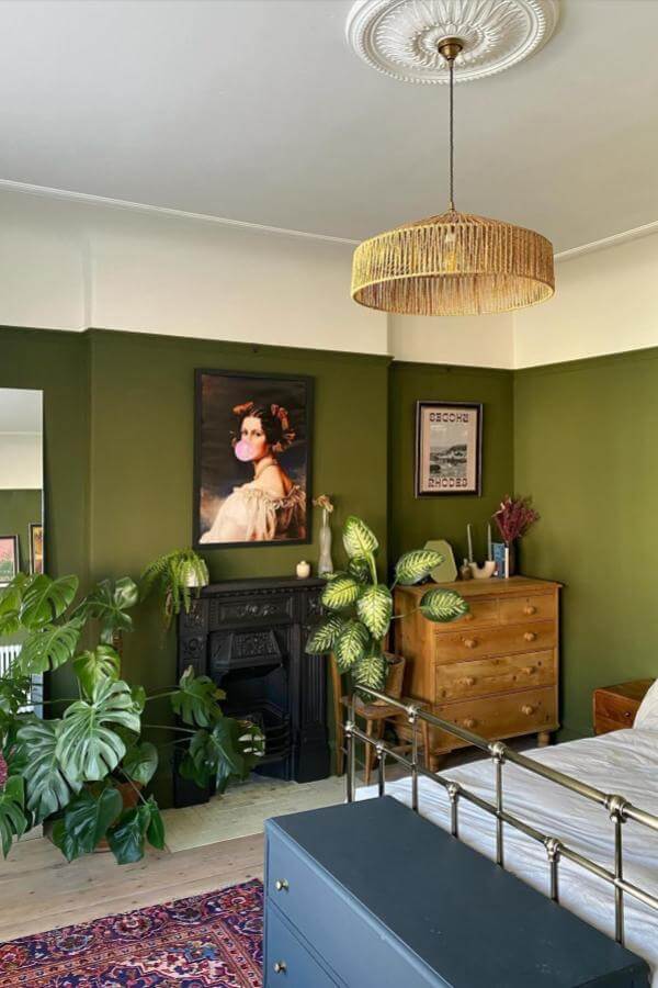 Playful pastel wall art brightens cozy olive-toned room from @our_newbrighton_project, adding charm to green sanctuary.