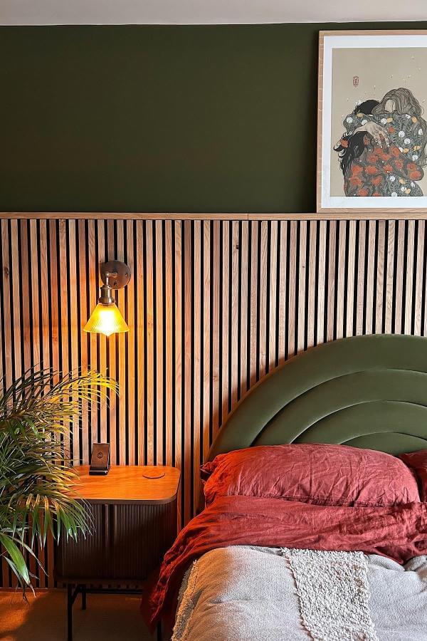 Warm-toned slatted wood accent wall from @out.with.the.artex showcasing natural charm and texture in modern interior design.