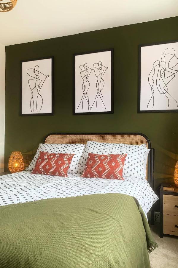 Striking line art olive wall from @thelittlegosford enlivens olive green bedroom with bold, artistic flair.