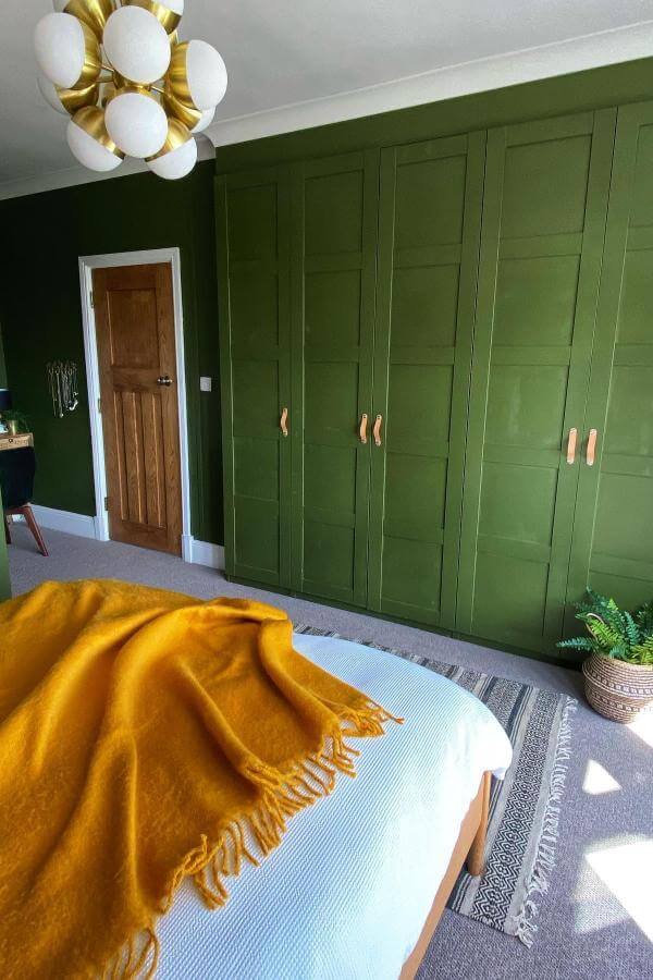 Statement olive green wardrobes from @thenewfrontwall brighten olive green bedroom ideas with bold, modern style.