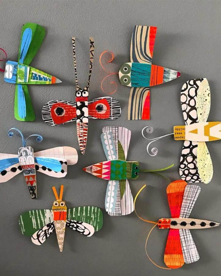 Bright colorful paper and balsa wood insects on grey background from @clareyoungs showing paper crafts for adults creative style.
