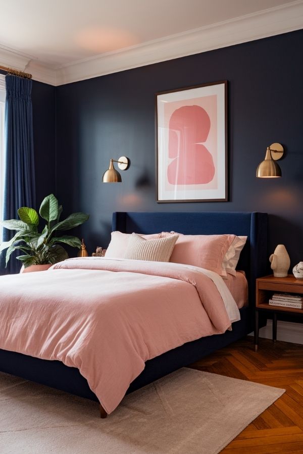 Pink and navy bedroom with plush bedding and stylish decor elements.