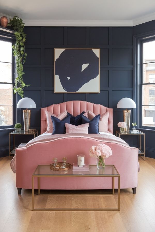 Pink and navy bedroom with cozy textiles and modern decor accents.